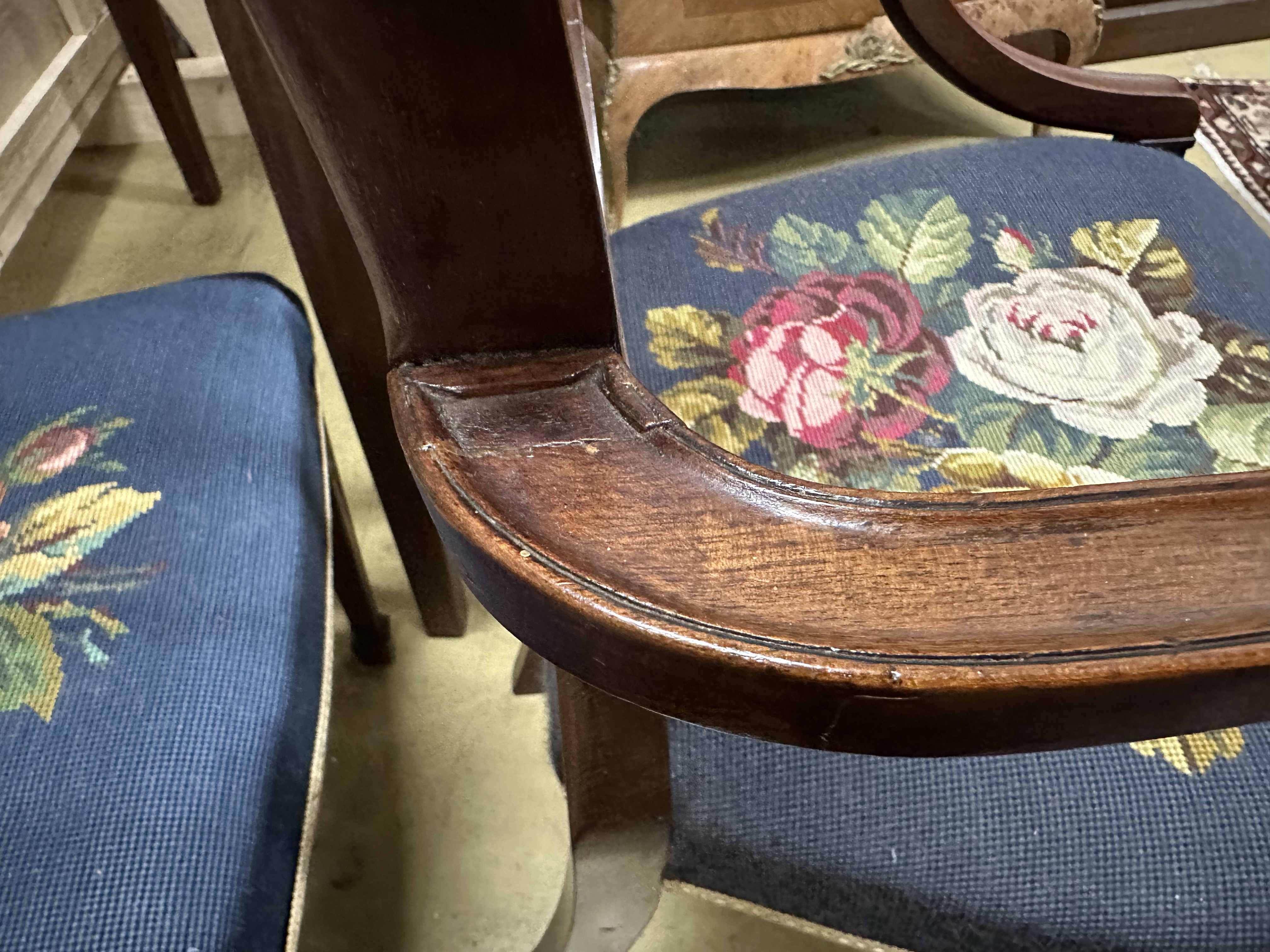 A set of eight Edwardian Hepplewhite style mahogany dining chairs with tapestry seats, two with arms